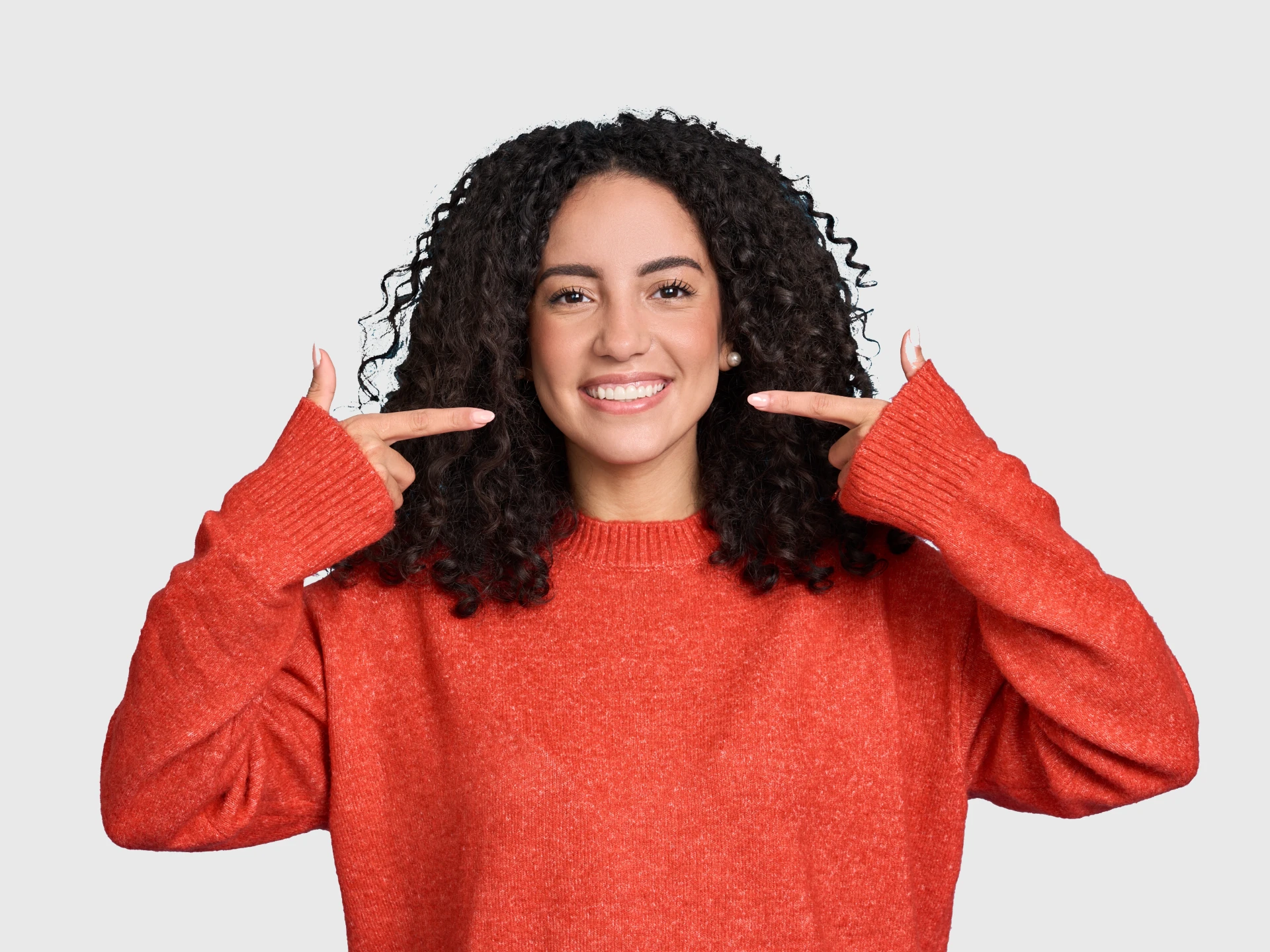 Young woman smiling after teeth cleaning